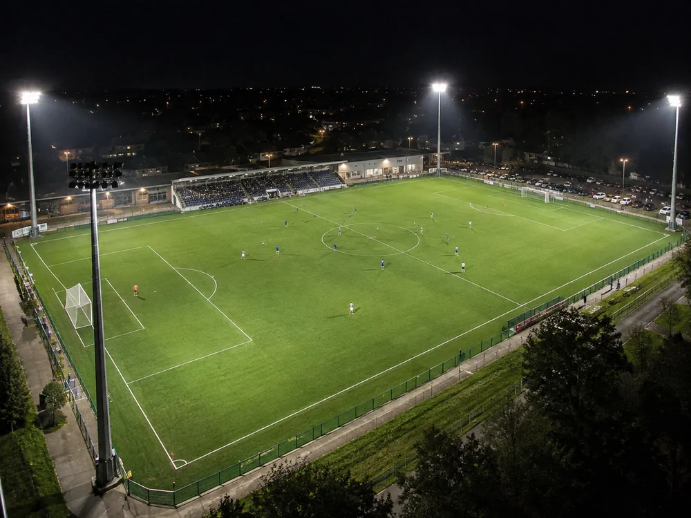 Four-Corner Football Field Lighting Layout Football field illuminated by four high-mast corner lighting positions